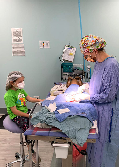 Dr. Eaton and daughter in surgery